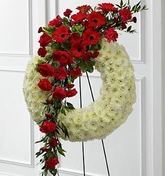Corona de aro de crisantemos, claveles y gerberas